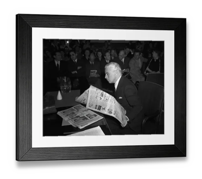 Framed Print : Charlie Chaplin Reading a Newspaper Framed Print : Charlie Chaplin Reading a Newspaper