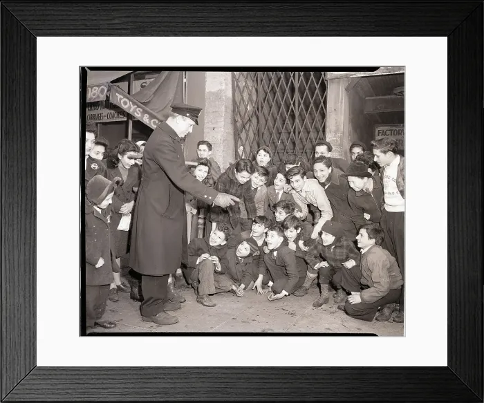 Framed Print : Policeman Reprimands Young Dice Players Framed Print : Policeman Reprimands Young Dice Players