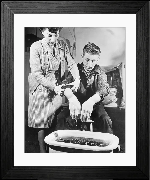 Framed Print : Nurse Helping Frostbite Victim Framed Print : Nurse Helping Frostbite Victim