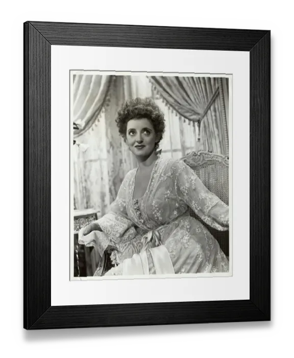 Framed Print : Actress Bette Davis in Lacy Loungewear and Sitting on Sofa Framed Print : Actress Bette Davis in Lacy Loungewear and Sitting on Sofa