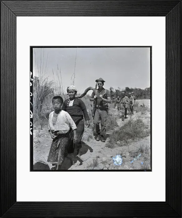 Framed Print : Boy, Woman In Front Of Line Of Troops