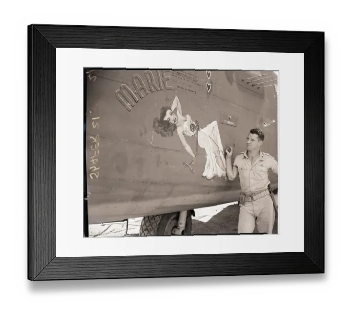Framed Print : Pilot Admiring Decal of Woman on Plane