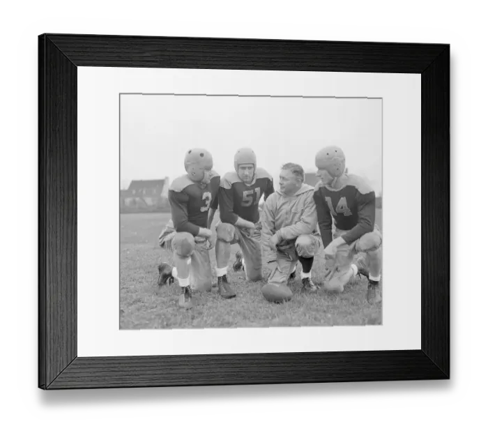Framed Print : Coach Lambeau Meeting with Players Framed Print : Coach Lambeau Meeting with Players