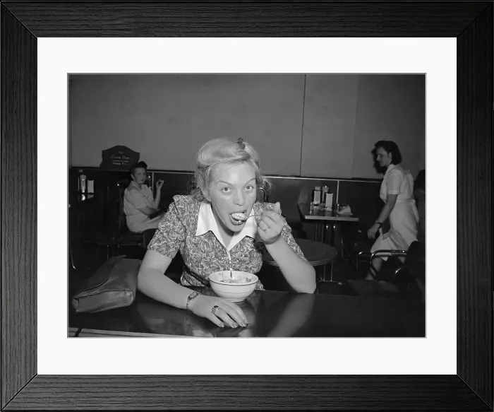 Framed Print : Young woman devouring ice cream dessert Framed Print : Young woman devouring ice cream dessert