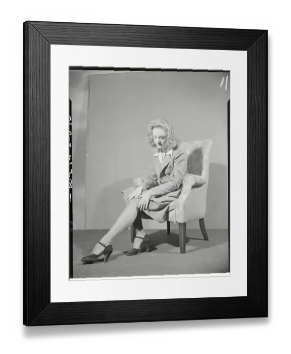 Framed Print : Young Woman Modeling Pair of Homemade Hosiery Framed Print : Young Woman Modeling Pair of Homemade Hosiery