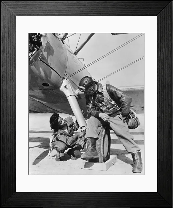 Framed Print : Man and Woman Look at Plane Underside Framed Print : Man and Woman Look at Plane Underside
