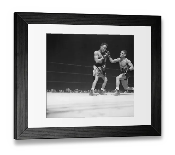 Framed Print : Lightweight Boxer Punching Opponent in Bout