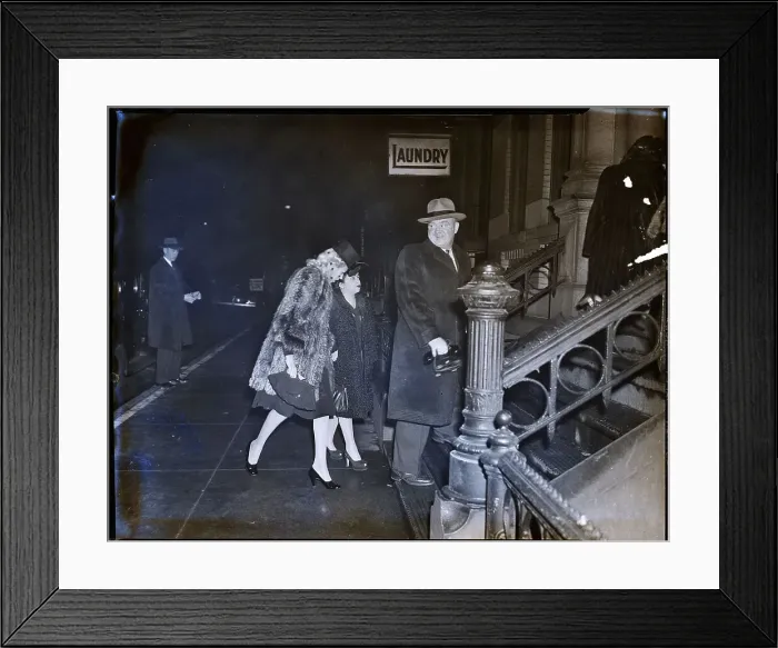 Framed Print : Policeman Poses Taking In Fur-Clad Women Framed Print : Policeman Poses Taking In Fur-Clad Women