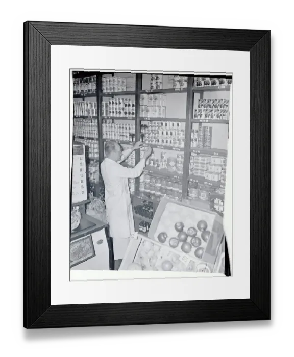 Framed Print : Storekeeper Adjusting Stock Framed Print : Storekeeper Adjusting Stock