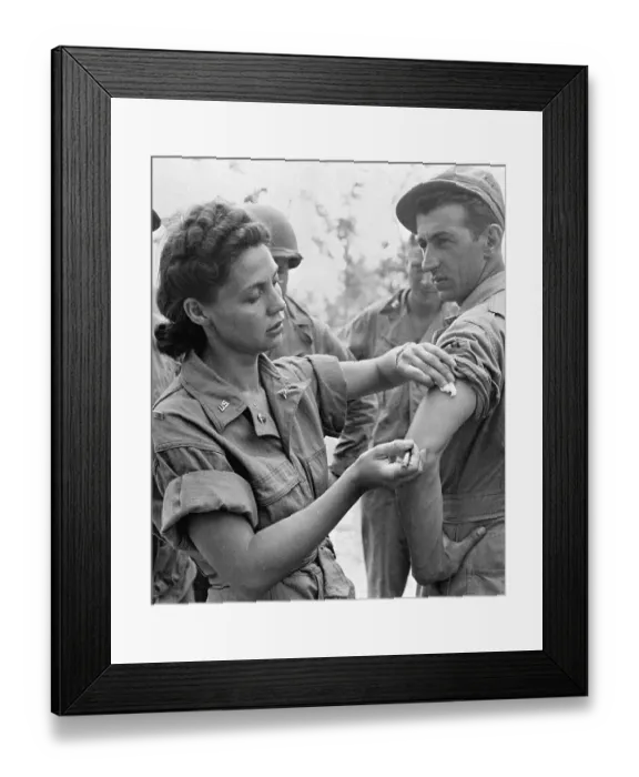 Framed Print : Female Lieutenant Giving Injection to Soldier Framed Print : Female Lieutenant Giving Injection to Soldier