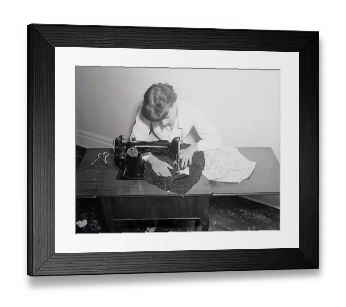 Framed Print : Woman Working On Sewing Machine Framed Print : Woman Working On Sewing Machine