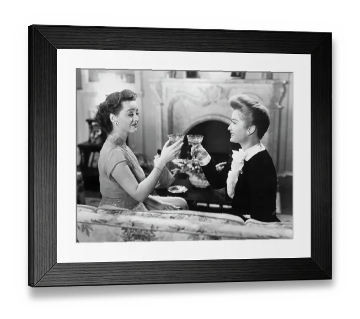 Framed Print : Bette Davis And Miriam Hopkins Toasting Framed Print : Bette Davis And Miriam Hopkins Toasting