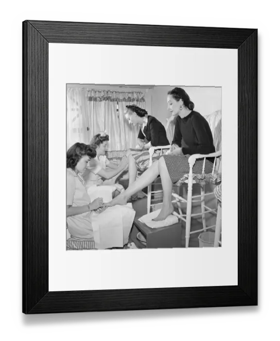 Framed Print : Women Being Treated at Leg Bar Framed Print : Women Being Treated at Leg Bar