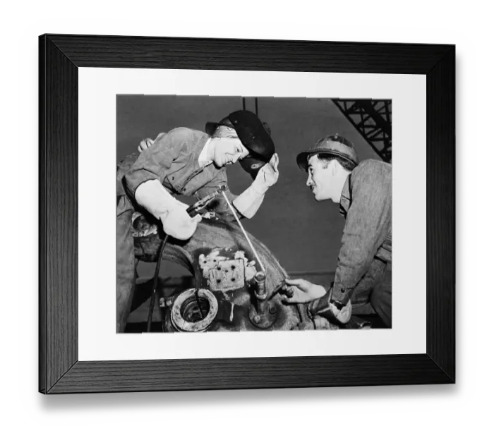 Framed Print : Woman Welds To Repair Manpower Shortage Framed Print : Woman Welds To Repair Manpower Shortage