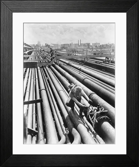 Framed Print : Man Opening Oil Pipeline Valve