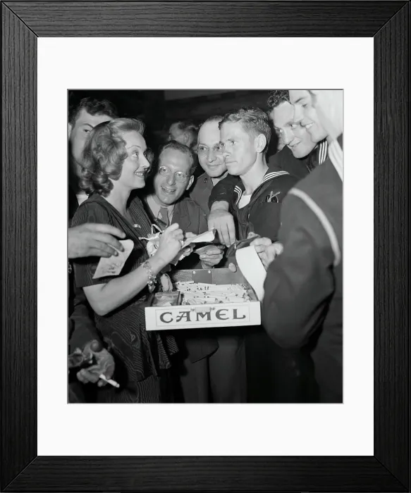 Framed Print : Bette Davis Talking Among Service Men Framed Print : Bette Davis Talking Among Service Men