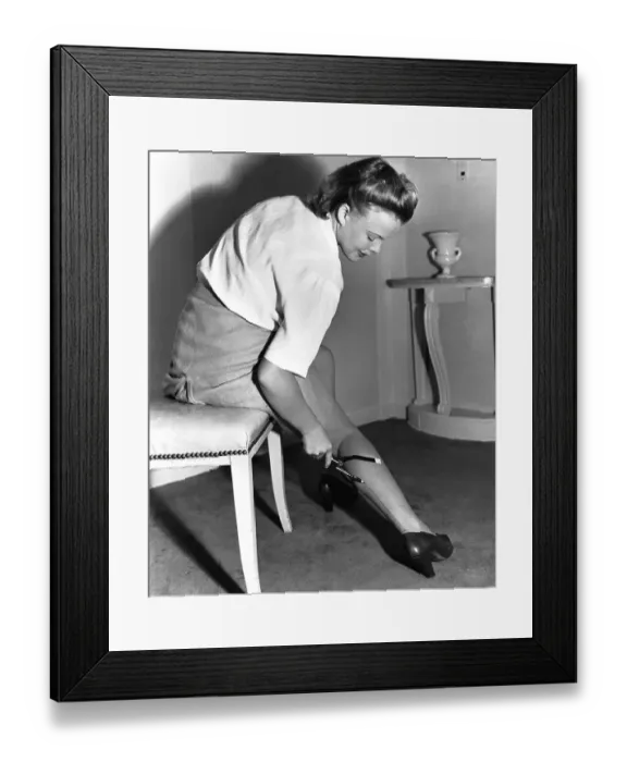 Framed Print : Actress Drawing Seams on a Stocking Framed Print : Actress Drawing Seams on a Stocking