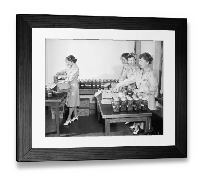 Framed Print : Women Packing Canned Food For Storage Framed Print : Women Packing Canned Food For Storage