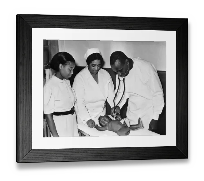 Framed Print : Doctor Examines Baby Framed Print : Doctor Examines Baby