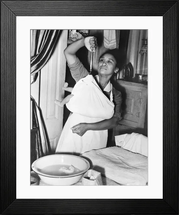 Framed Print : Black Nurse Weighing Baby Framed Print : Black Nurse Weighing Baby