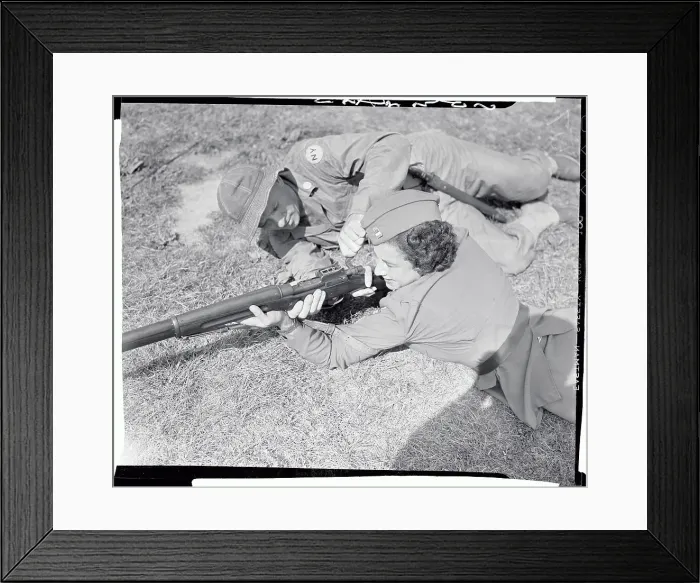 Framed Print : Male Soldier Teaching Weapon Techniques to Female Officer Framed Print : Male Soldier Teaching Weapon Techniques to Female Officer