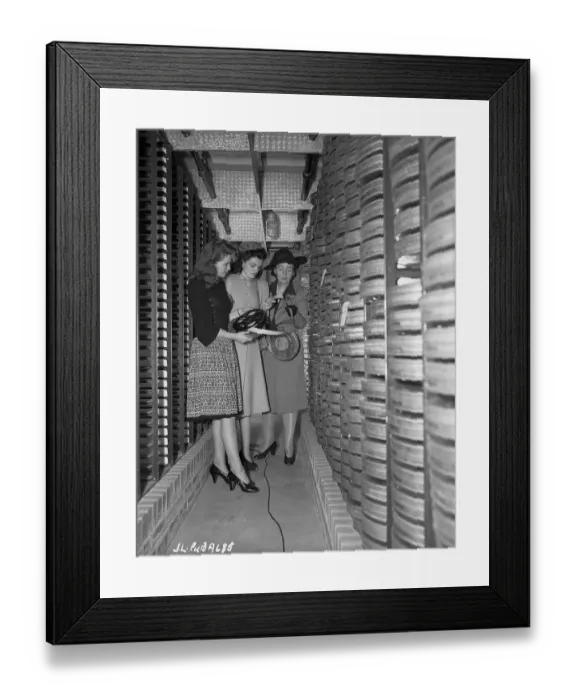 Framed Print : Joan Leslie and Family Looking at Films in a Film Vault Framed Print : Joan Leslie and Family Looking at Films in a Film Vault