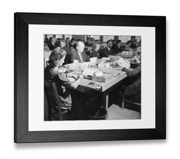 Framed Print : Worker In Post Office Inspects Envelopes