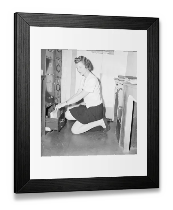 Framed Print : Store Clerk Kneels Wearing Legstick Framed Print : Store Clerk Kneels Wearing Legstick