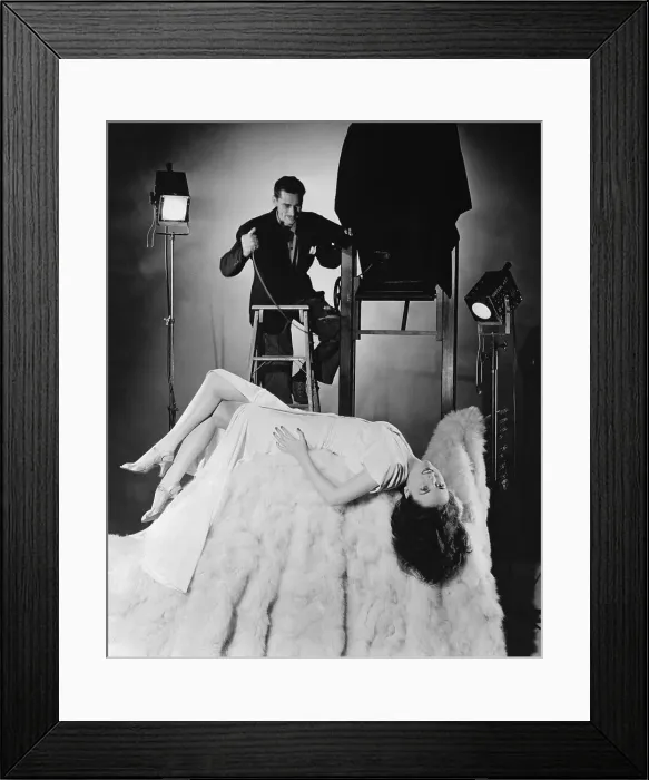 Framed Print : Woman Lying Down in Photo Studio Framed Print : Woman Lying Down in Photo Studio