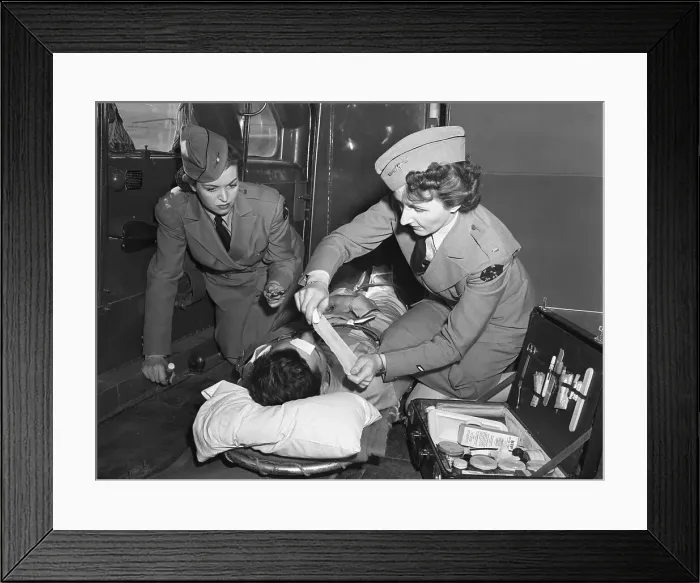 Framed Print : Military Nurses Treating Wounded Soldier Framed Print : Military Nurses Treating Wounded Soldier