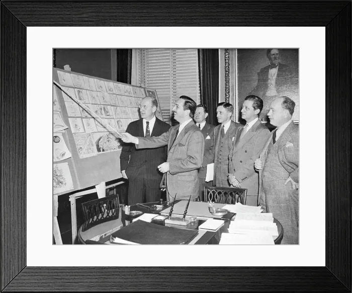 Framed Print : Walt Disney Pointing to Sketches on Board Framed Print : Walt Disney Pointing to Sketches on Board