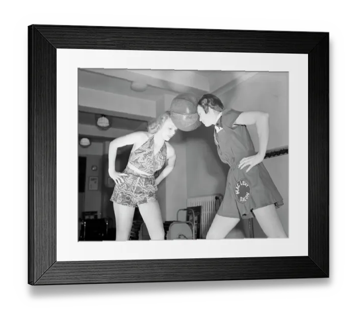 Framed Print : Women Hold Medicine Ball Between Heads Framed Print : Women Hold Medicine Ball Between Heads
