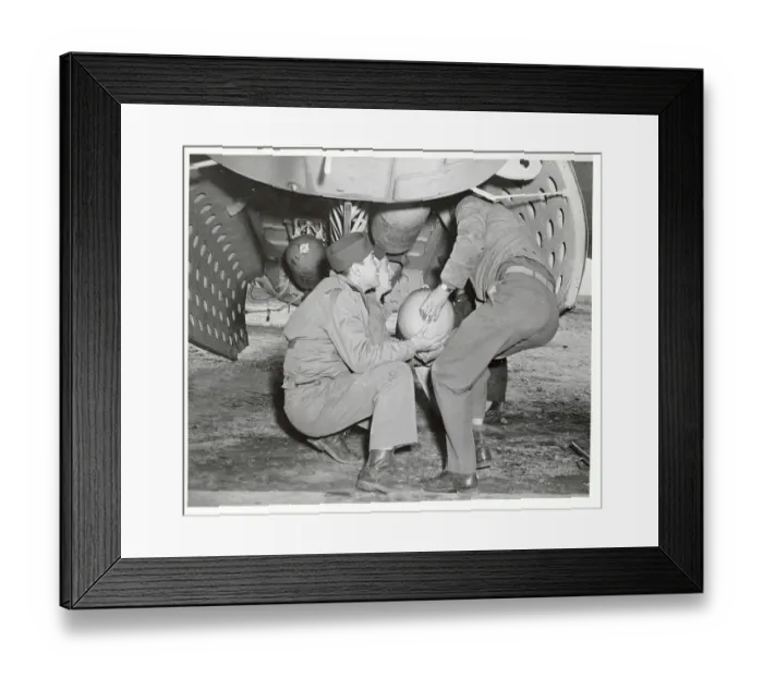 Framed Print : Soldiers Loading Bomb into Bay of Bomber Plane Framed Print : Soldiers Loading Bomb into Bay of Bomber Plane