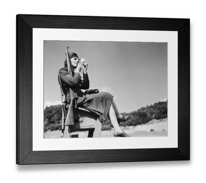 Framed Print : Woman Soldier Sitting and Applying Lipstick to Her Face Framed Print : Woman Soldier Sitting and Applying Lipstick to Her Face