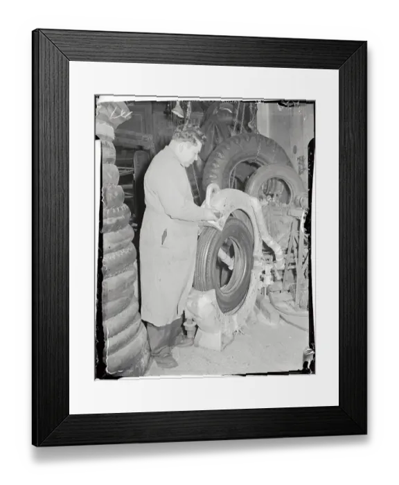 Framed Print : Worker Making a Tire Framed Print : Worker Making a Tire