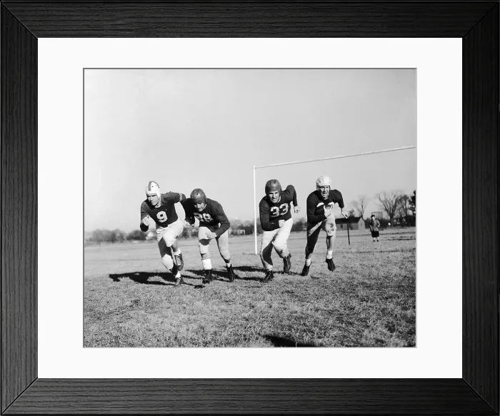 Framed Print : Football Players Running on Field Framed Print : Football Players Running on Field