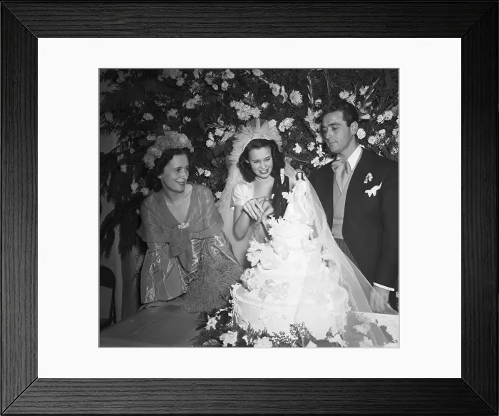 Framed Print : Gloria Vanderbilt And Groom Cut Cake