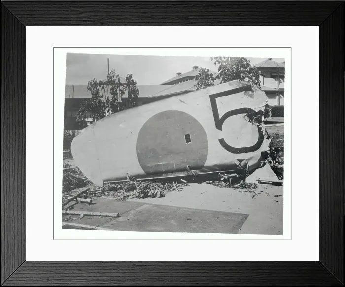Framed Print : Part of Fallen Airplane Wing Lying on Ground Framed Print : Part of Fallen Airplane Wing Lying on Ground