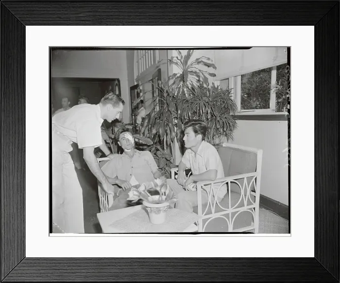 Framed Print : Doctor with Shrapnel Victims Framed Print : Doctor with Shrapnel Victims