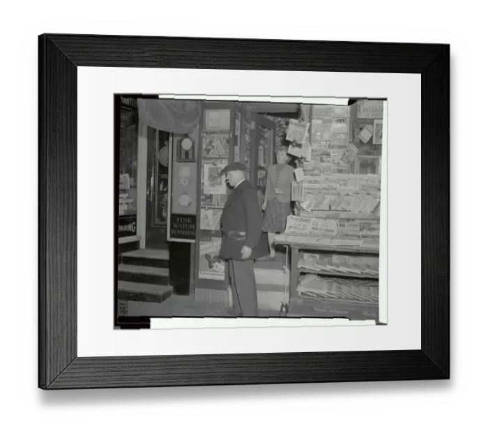 Framed Print : Angry Owner Standing by Newsstand Framed Print : Angry Owner Standing by Newsstand
