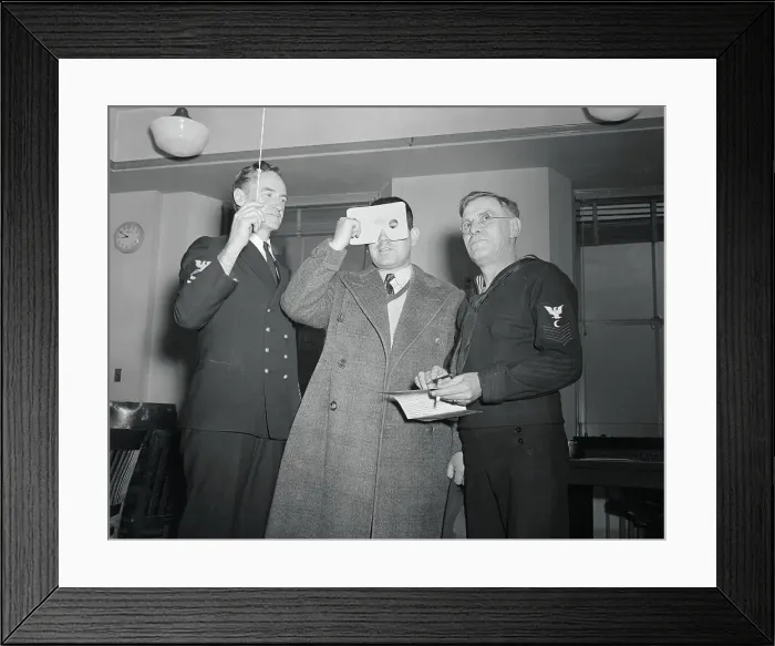 Framed Print : Doctor Checking The Eyesight of a New Prospective Recruit Framed Print : Doctor Checking The Eyesight of a New Prospective Recruit