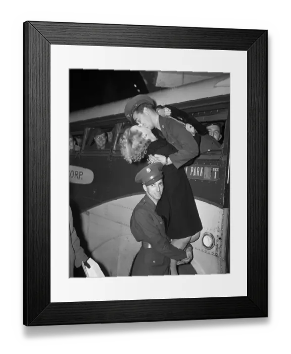 Framed Print : Soldier Holds Up A Girl To Kiss Soldier