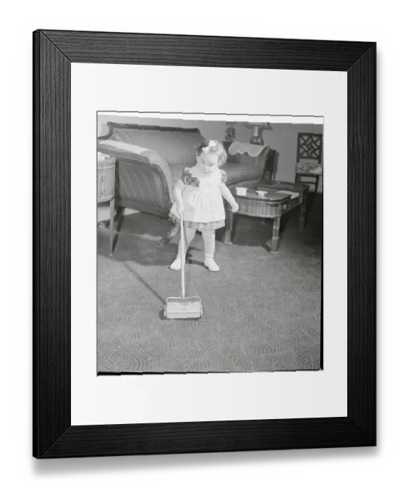 Framed Print : Young Toddler Using Her Toy Floor Sweeper