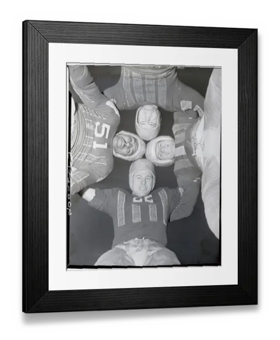 Framed Print : Football Players Standing in Huddle Framed Print : Football Players Standing in Huddle