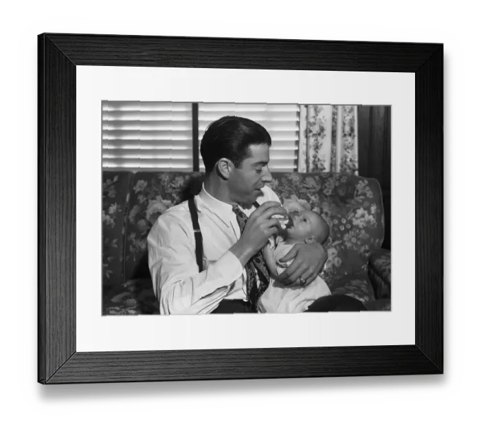 Framed Print : Joe DiMaggio Holding His Infant Son Framed Print : Joe DiMaggio Holding His Infant Son
