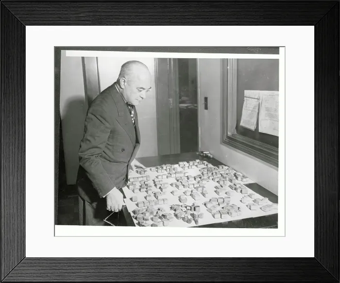 Framed Print : Thomas J. Callaghan Standing over Stamp Collection