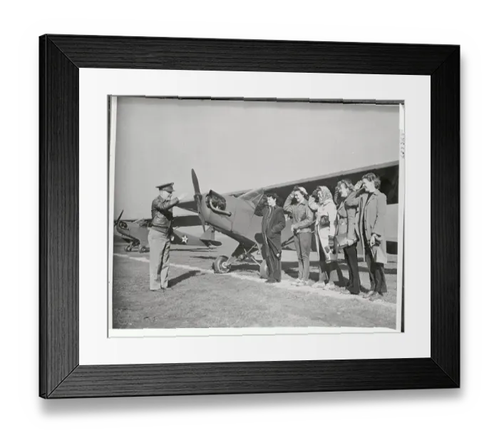 Framed Print : Women Pilots Saluting Near Airplane Framed Print : Women Pilots Saluting Near Airplane