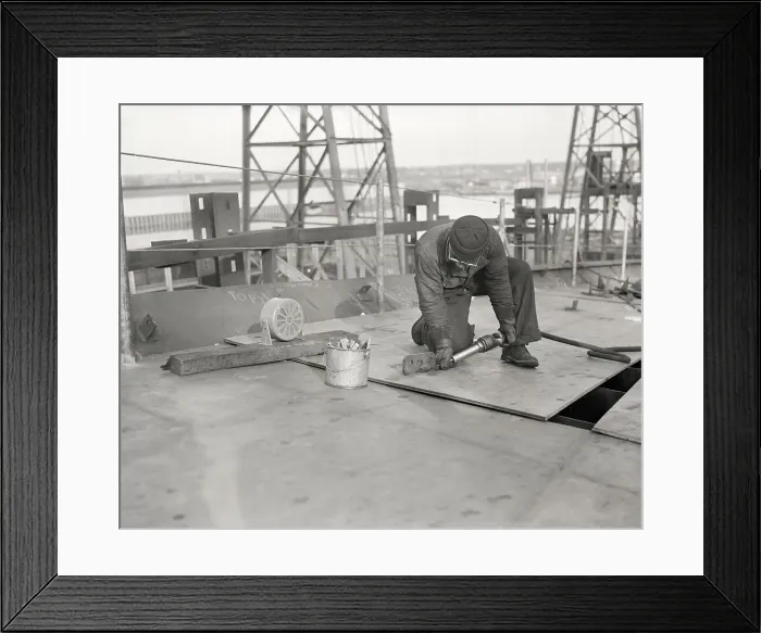 Framed Print : Man Riveting Ship In Navy Yard Framed Print : Man Riveting Ship In Navy Yard