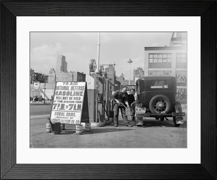 Framed Print : Gas Attendant Filling Gas Cans Framed Print : Gas Attendant Filling Gas Cans