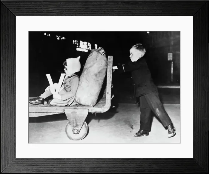 Framed Print : V Sign. Maureen McKeon, four, carries her own victory sign as she is given Framed Print : V Sign. Maureen McKeon, four, carries her own victory sign as she is given